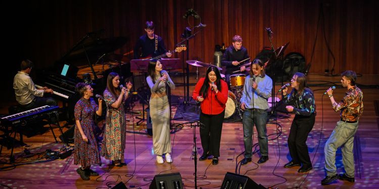 A group of jazz students on stage performing in Milton Court Concert Hall 
