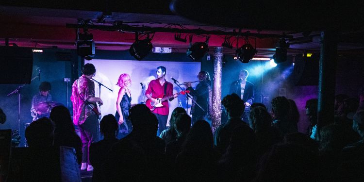 Charge showcase at Strongroom in Shoreditch - a crowded room of people dancing with a band on stage performing