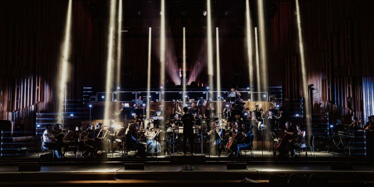 Guildhall Session Orchestra performing onstage with laser lighting