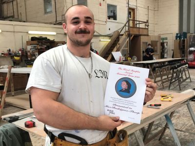 Max Rodriguez-Thorp holding Hazel Sharples prize certificate