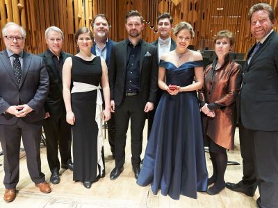 image of performers stood smiling in a row