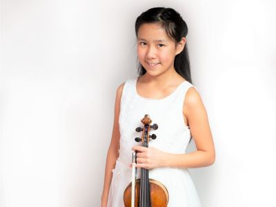 image of student holding a violin 