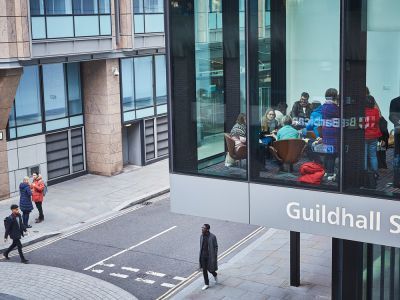 image of Milton Court campus with students walking by