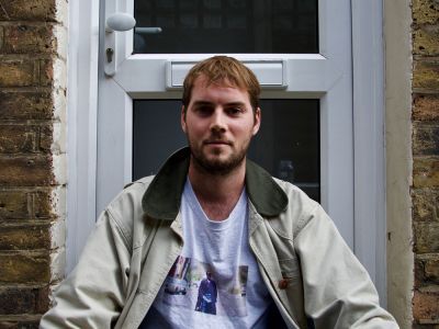 man sitting in front of door 