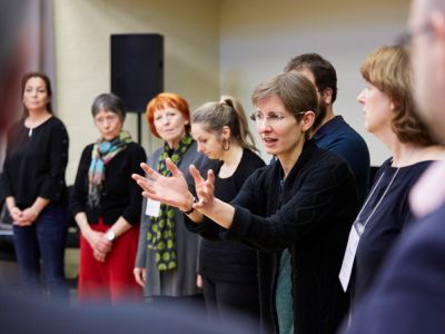 Woman speaking to a group 