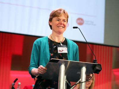 Woman standing at a lectern