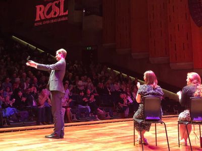 performers clapping onstage