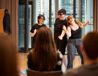 Three actors performing
