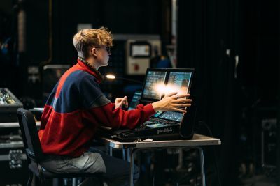 Student using a grandMA3 lighting control platform