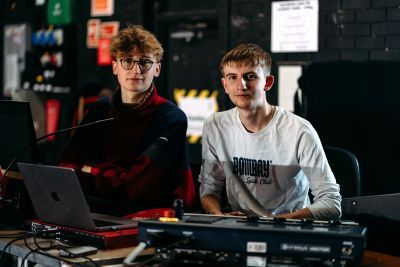 Students in a studio with technical equipment