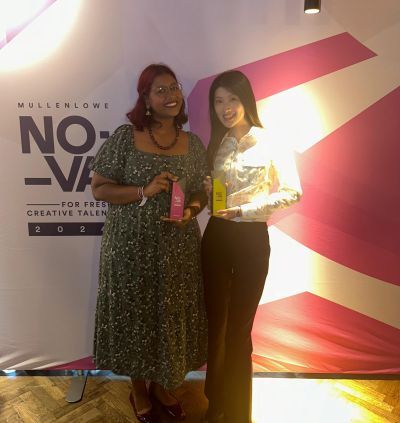 Students holding awards at an event