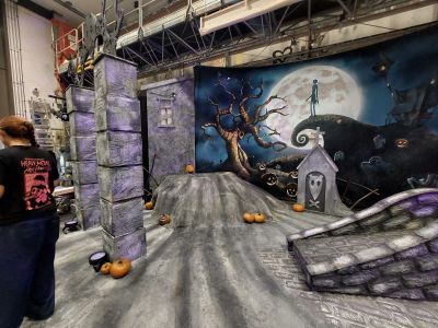 Stage set with spooky sky, pumpkins and a bridge