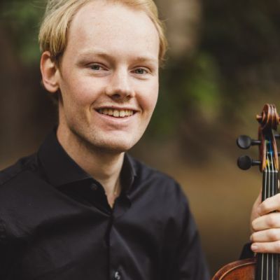 Violinist Krystof Kohout smiling.jpg