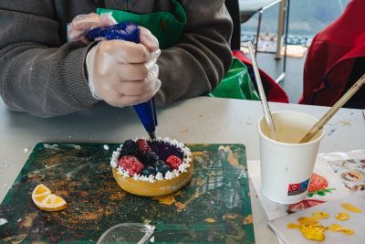 Fake fruit tart being created