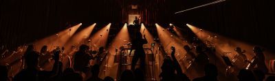 Guildhall Session Orchestra performing with strobe lighting 